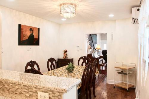 a kitchen and dining room with a table and chairs at Walk to South Philly's Best Restaurants & Bars in Philadelphia