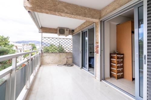 a balcony with a view of the city at SummerVibes Penthouse Varkiza in Vari