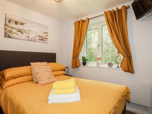 Postel nebo postele na pokoji v ubytování Blue Sky Cottage