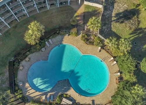 an overhead view of a swimming pool in a yard at Pirates Bay B303 in Fort Walton Beach