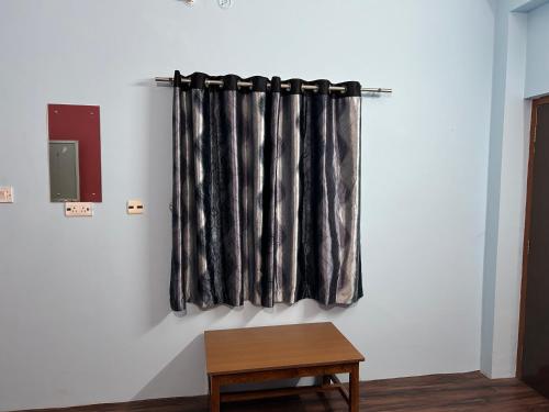 a black and white curtain hanging on a wall at Sangam palace in Bettiah