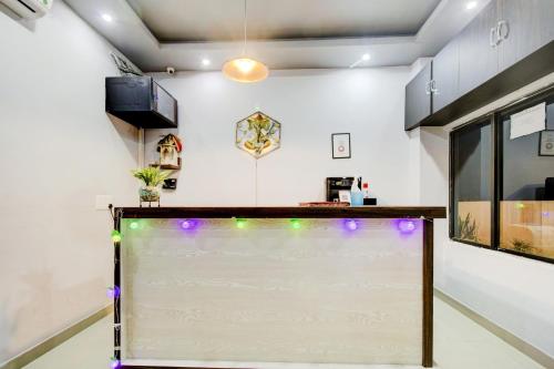 a white board in a room with lights at Townhouse Volga Homes in Guwahati