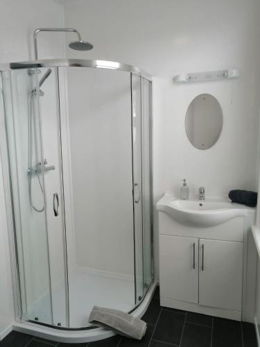 a bathroom with a shower and a sink at Central Luxury Town House in Blackpool
