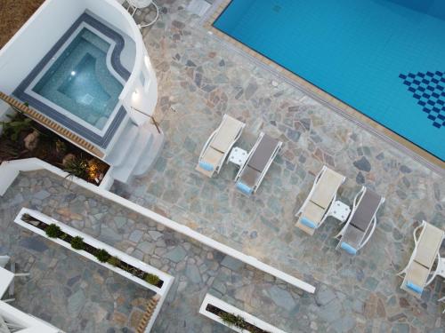 an overhead view of a swimming pool with chairs and a swimming pool at Remvi in Galissas