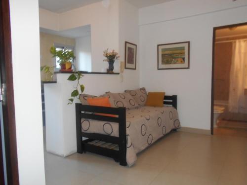 a living room with a couch in a room at Departamento Dean Funes in Salta