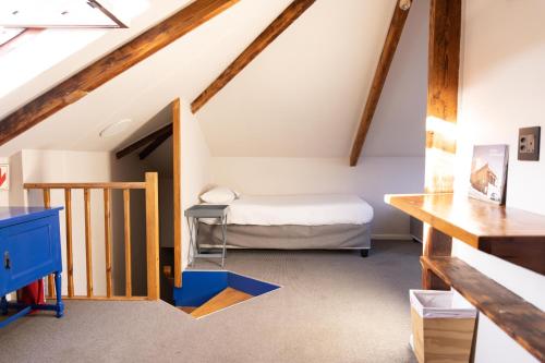 a bedroom with a bed in a attic at Villa Viva Cape Town in Cape Town