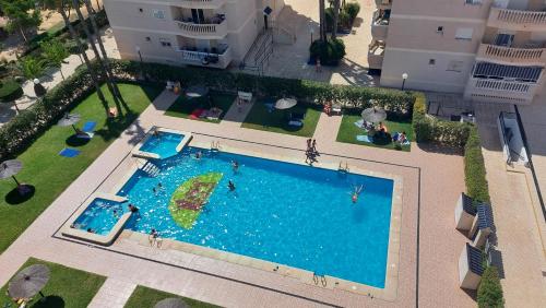 an overhead view of a swimming pool in a building at Arenales Sea View Apartment in Arenales del Sol