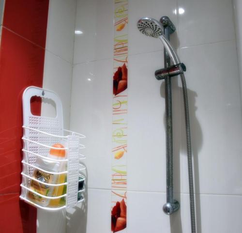 a bathroom with a shower with a shower head at Confort et tradition au coeur de la ville - Faire demande de réservation - in El Jadida