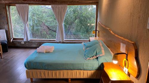 Ліжко або ліжка в номері Sierras Oasis Apart