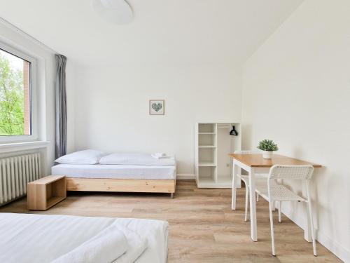 Postel nebo postele na pokoji v ubytování Tolstov Apartments - Monteurwohnungen - 3 Schlafzimmer - Küche - Balkon - Waschmaschine - 25 Min zur Messe DUS