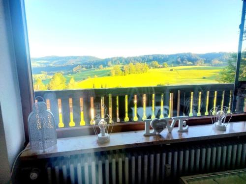 a window with a view of a golf course at Berg-Juwel mit Pool und Sauna für Familien und Hunde ideal in Missen-Wilhams