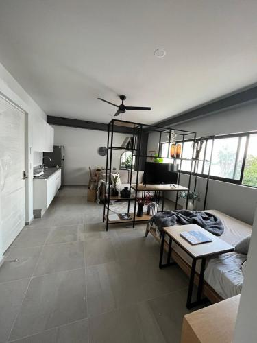 a living room with a couch and a table at Morada Living in Guadalajara