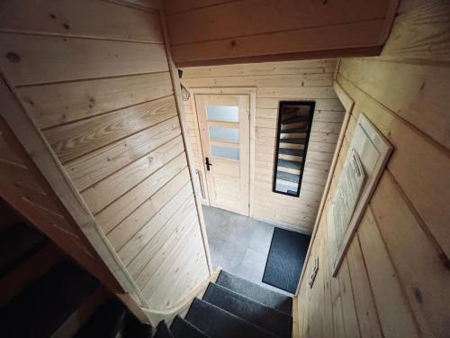 an overhead view of a staircase in a wooden cabin at Domek RajskiRaj in Rajcza