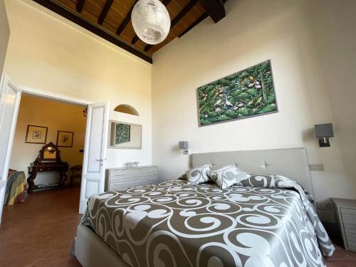 a bedroom with a large bed in a room at Appartamento Mimosa in Siena