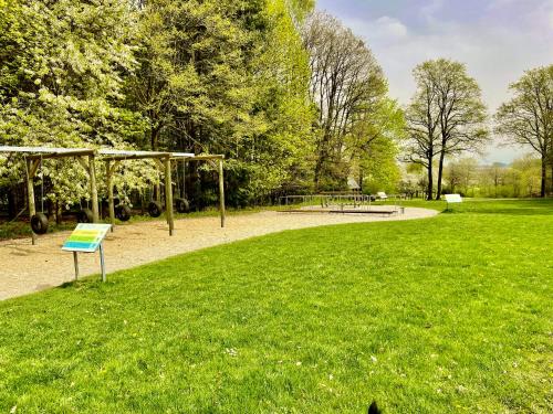 a park with a playground and a picnic table at Hallelujah - Wunderschönes und gepflegtes Apartment mit Bademantelgang zur Therme in Bad Griesbach
