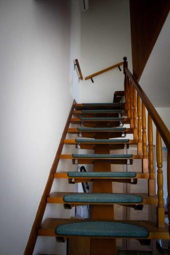 a set of stairs with green surfboards on them at Kuća za odmor Ante in Ilok