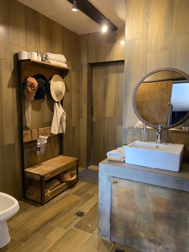 a bathroom with a sink and a mirror at Casa Felix in Las Heras