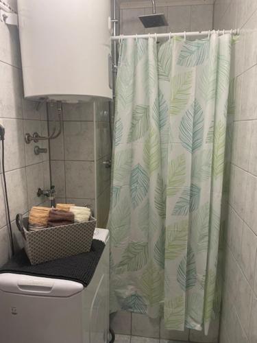 a shower curtain in a bathroom with a toilet at Mirna in Senj