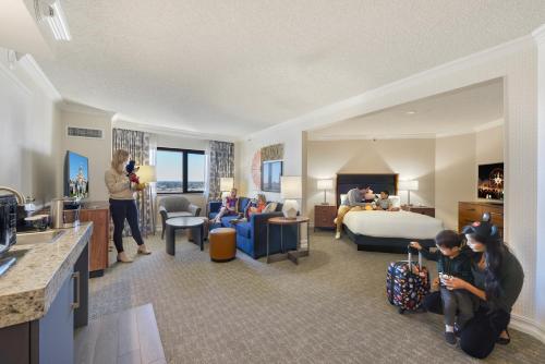 a hotel room with people in a suite at Embassy Suites by Hilton Anaheim-Orange in Anaheim