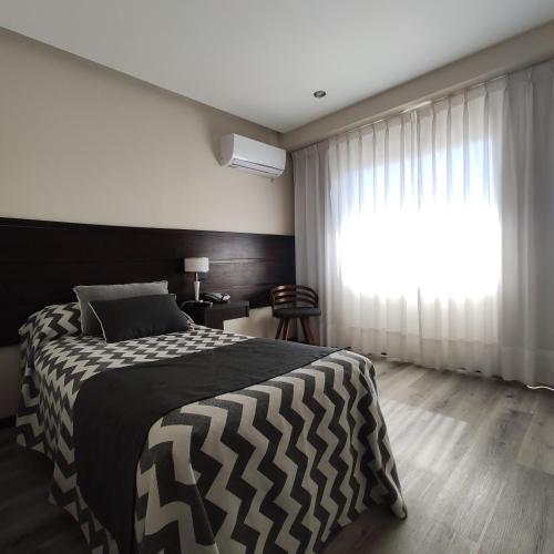 Postel nebo postele na pokoji v ubytování Hotel Nijar