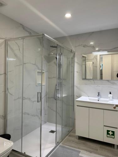 a bathroom with a shower and a sink at CANAVESES RIVER HOUSE - ALOJAMENTO RURAL in Marco de Canaveses