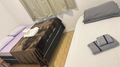 En eller flere senge i et værelse på Cantinho familiar 200m Hospital Regional