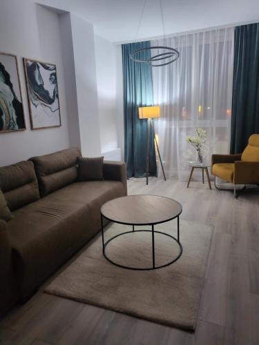 a living room with a couch and a table at Jagodica in Trnava