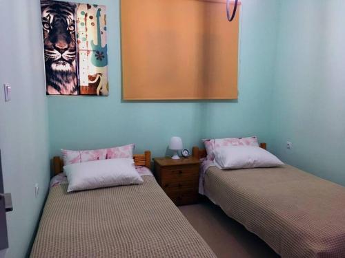 เตียงในห้องที่ Cosy Beach House in Agios Vasilios, Patras