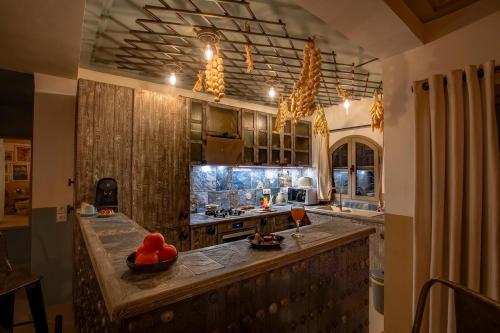 a kitchen with a large island with fruit on it at LES TANNEURS PENTHOUSE MARRAKECH in Marrakesh