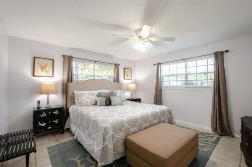 a bedroom with a bed and a ceiling fan at Dauphin Island in Forney