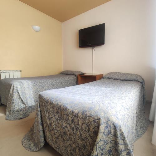 Postel nebo postele na pokoji v ubytování Hotel Nijar
