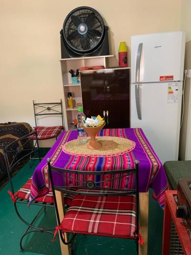 a kitchen with a table with a bowl on it at Cabaña Apacheta Mi Campito Cachi Salta in Cachí