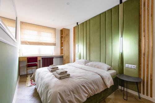 Кровать или кровати в номере Mazurskie lokum