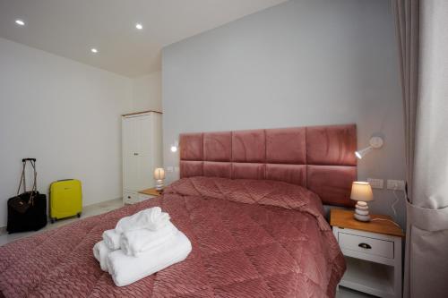 Postel nebo postele na pokoji v ubytování REDDIMUS Guest House