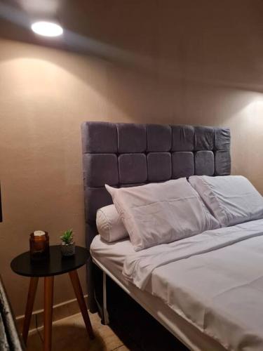Säng eller sängar i ett rum på Pertim da Serra