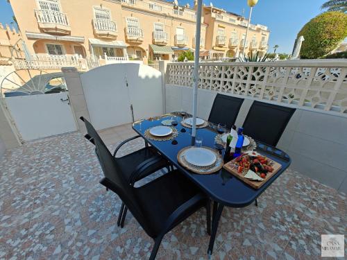 a blue table with food on top of a balcony at Casa Miramar in Ciudad Quesada