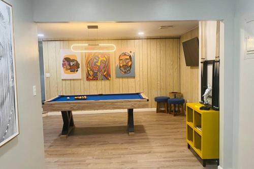 a room with a ping pong table in a room at Beautiful Home with Bay View minutes from AC in Pleasantville