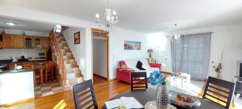a kitchen and a living room with a dining room at Madeira Island Villa Oceane Ribeira Brava in Ribeira Brava
