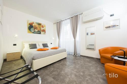 Postel nebo postele na pokoji v ubytování San Cosmo Suite