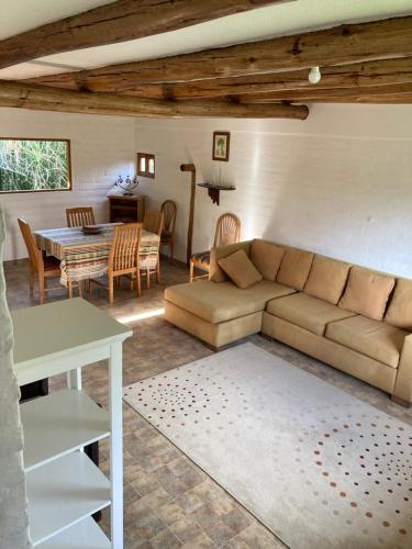 a living room with a couch and a table at Casa Semilla in Cotacachi