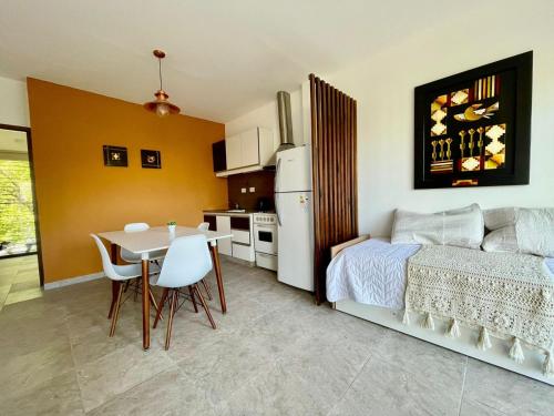 a kitchen and a bedroom with a bed and a table at Florencia Hospedaje in Tupungato