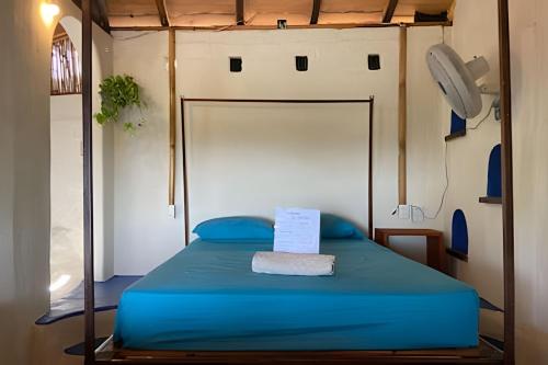 Un ou plusieurs lits dans un hébergement de l'établissement Mixtli Ecohouse, Habitaciones Sol & Luna - Starlink Internet