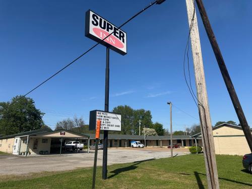 a sign for a supercenter in a parking lot at super inn in Newport