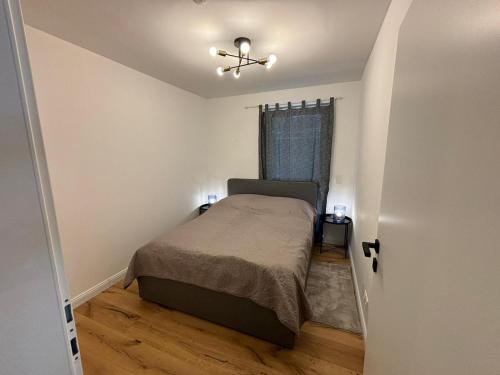 Postel nebo postele na pokoji v ubytování Aparthotel Infinity