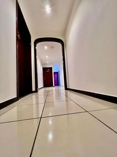 an empty hallway with a large mirror on the wall at Luxury Awaits: Master Bedroom for Rent! Indulge in comfort and style. in Sharjah