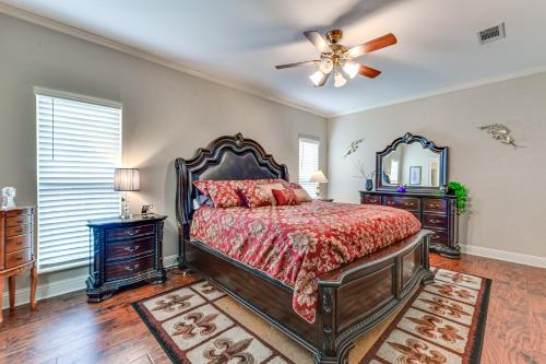 a bedroom with a bed and a ceiling fan at Baton Rouge Retreat with Patio, Grill and Fire Pit! in Baton Rouge