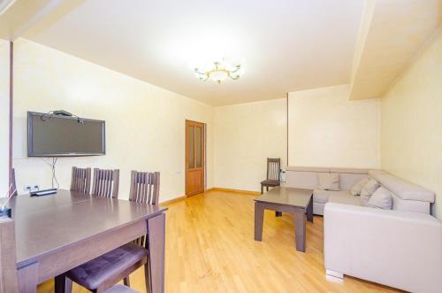 a living room with a couch and a table at Amiryan15/7 Excellent apartment in the center in Yerevan