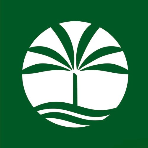 a green and white leaf logo on a green background at River Palm Hotel in Melbourne