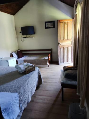 Televisyen dan/atau pusat hiburan di Hotel Fazenda Upã Moña