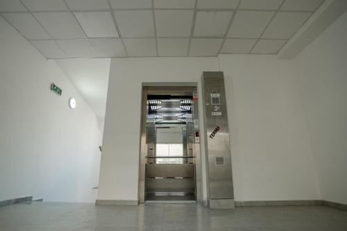 an empty hallway with an elevator in a building at Lalas' apartment in Ohrid